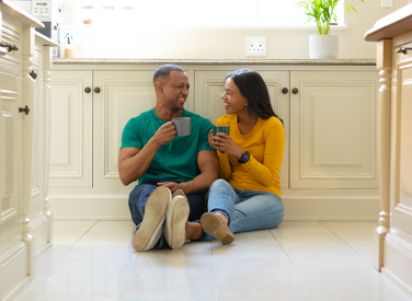 Couple Smiling in New Kitchen